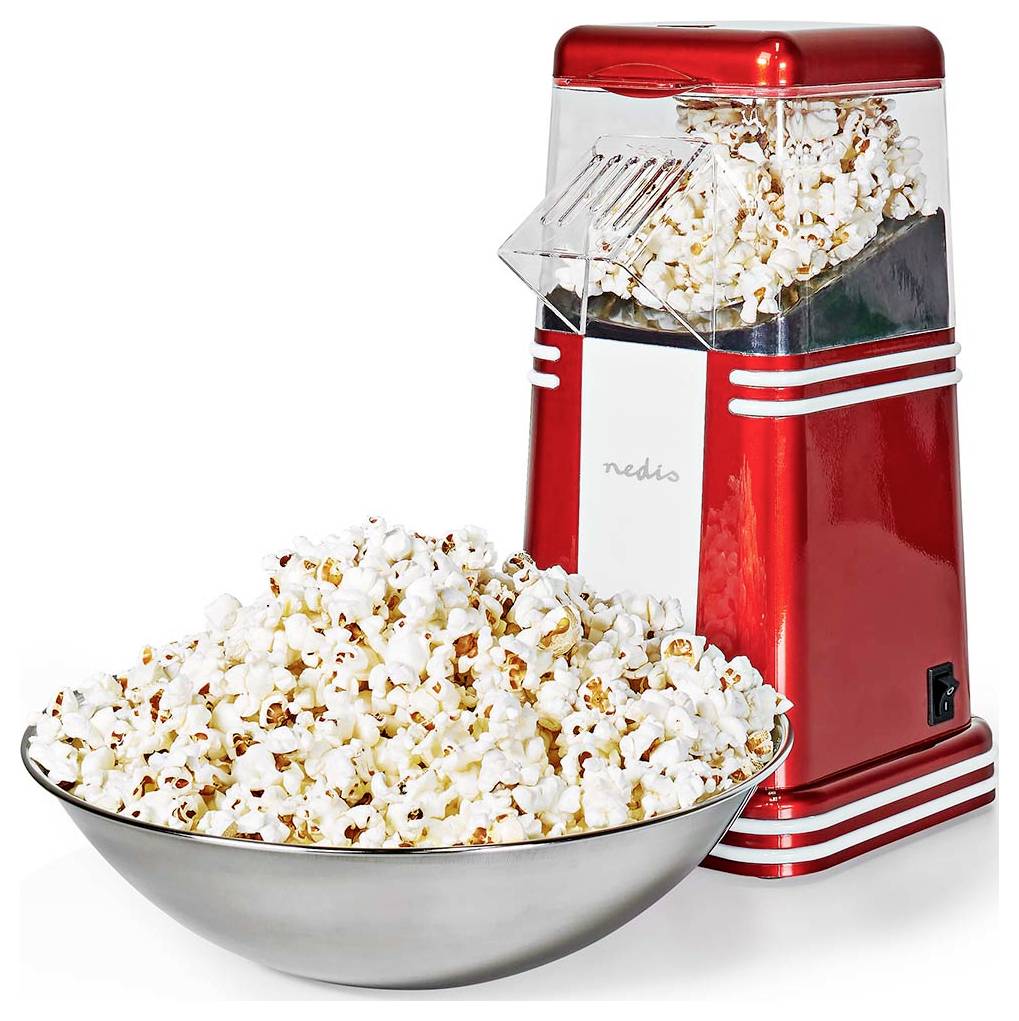 Un appareil à pop-corn rétro rouge avec du maïs soufflé débordant dans un grand bol en métal devant lui.