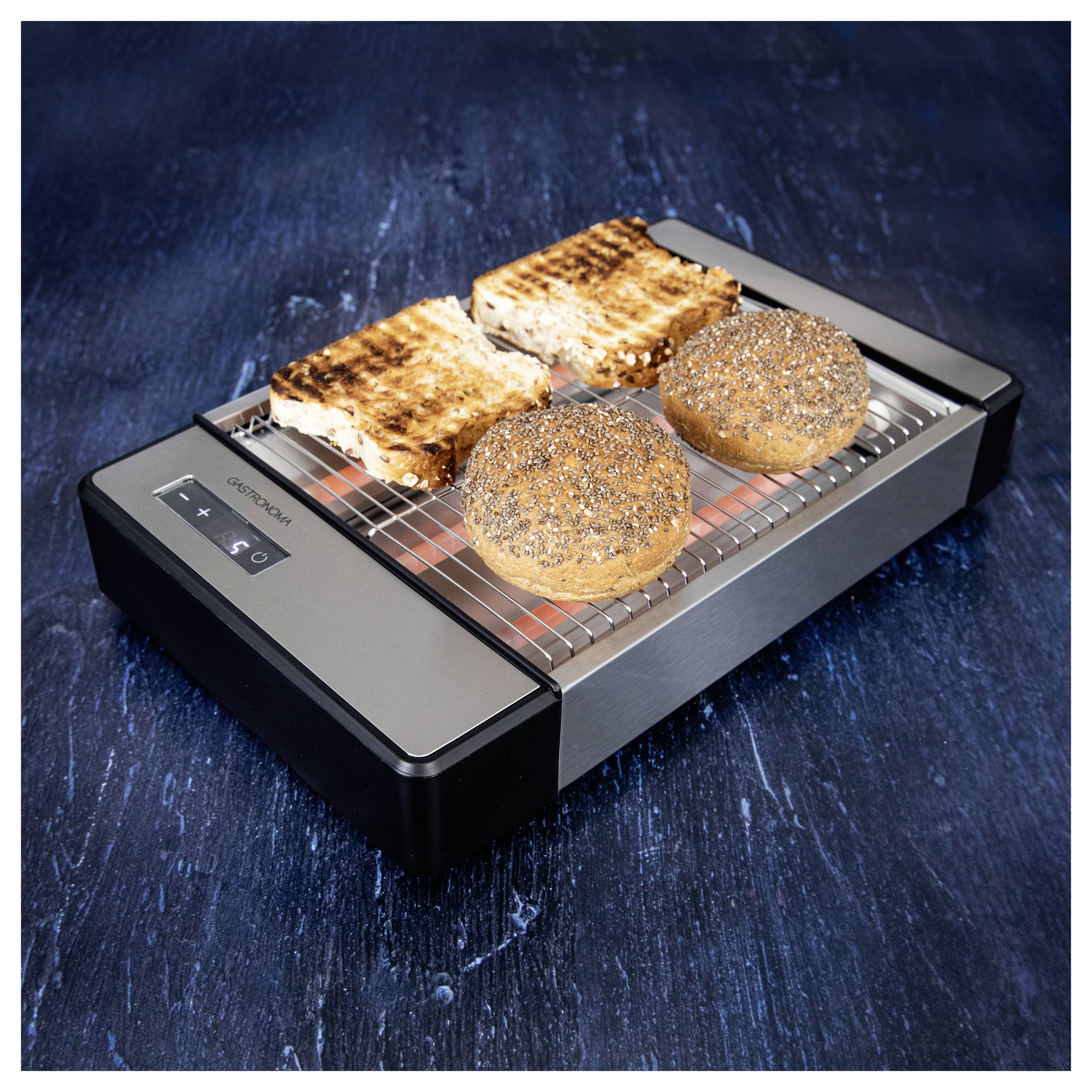 Quatre tranches de pain légèrement grillées, dont deux parsemées de graines de pavot, reposent sur un grille-pain moderne en acier inoxydable au design épuré avec une grille ouverte.