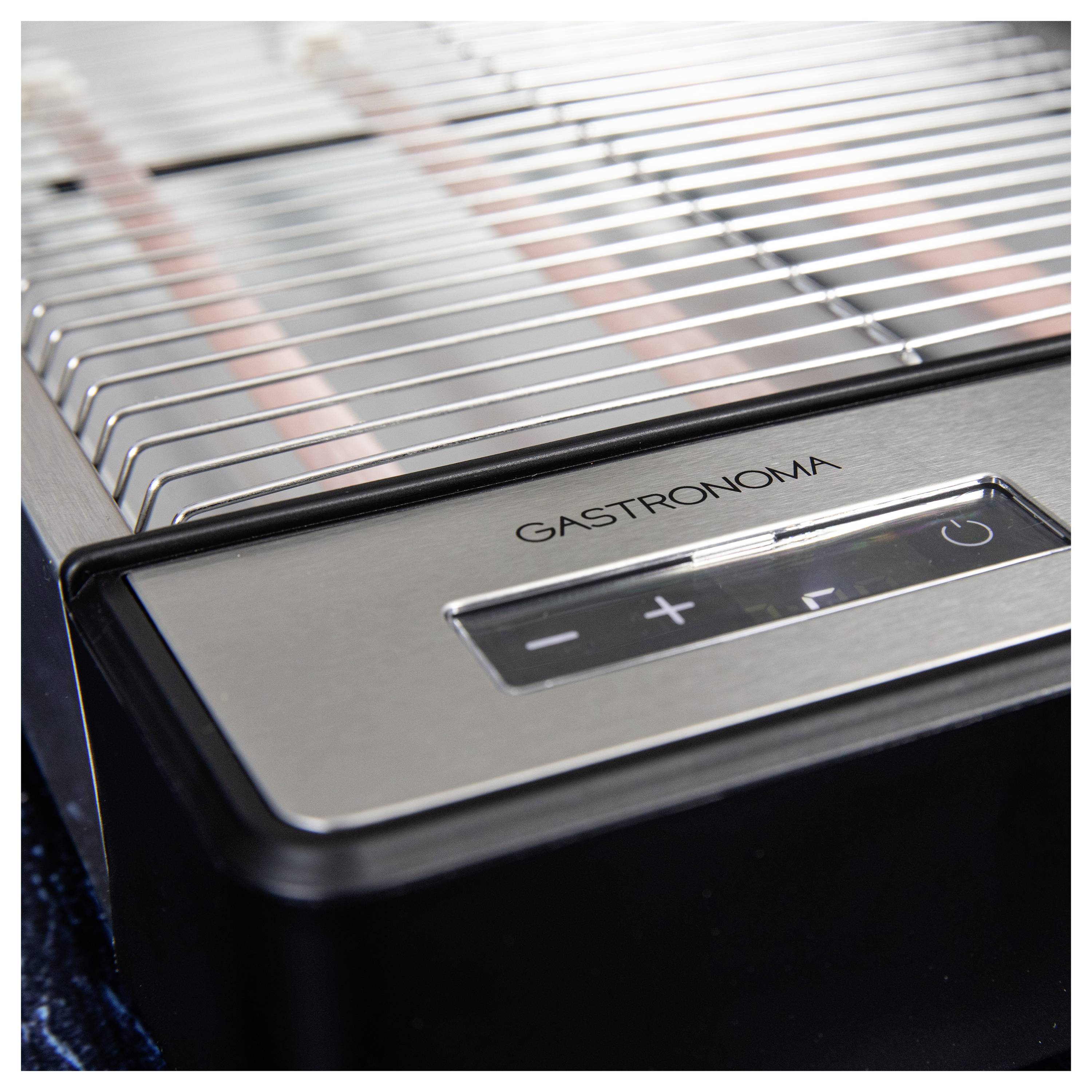 Un gros plan d'un appareil électroménager de cuisine en acier inoxydable portant la marque 'Gastronoma' et doté de boutons de commande pour des réglages plus et moins.