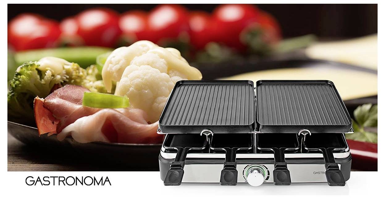 Un grill à raclette au premier plan, entouré de légumes frais et de tranches de jambon en arrière-plan. Le nom de marque 'Gastronoma' apparaît sur le côté.