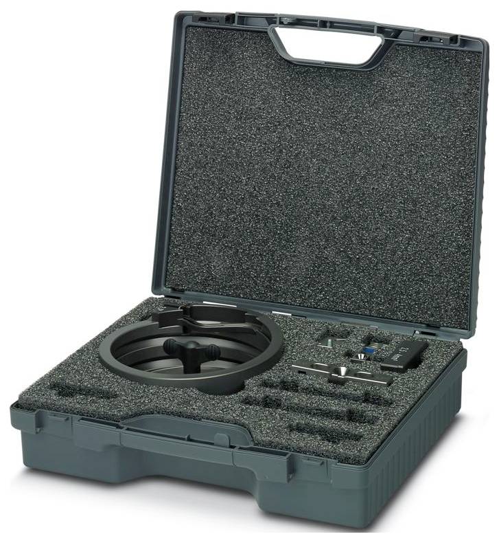 A green carrying case with foam inserts holds a circular saw guide rail attachment and various tools and components neatly organized.
