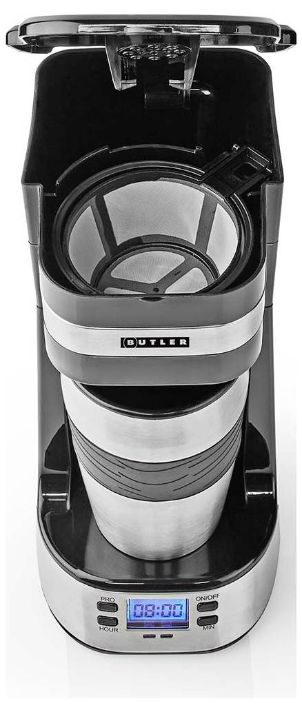 Machine à café à dosette individuelle avec écran numérique affichant '03:00', filtre réutilisable, et mug de voyage en acier inoxydable placé en dessous.