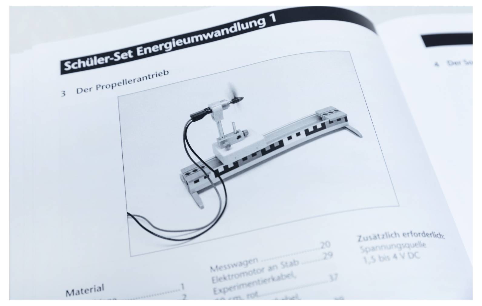 Image of a textbook page titled 'Schüler-Set Energieumwandlung 1', showing a propeller setup illustration on a table.