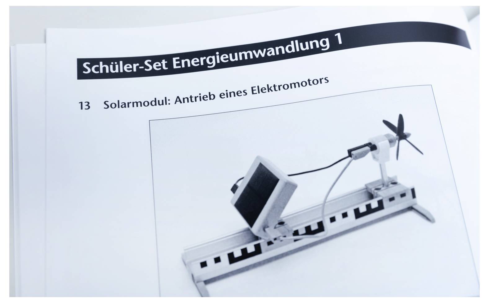 'Student Set Energy Conversion 1: Solar Module; Driving an Electric Motor'. A schematic shows a solar panel powering a small fan motor.