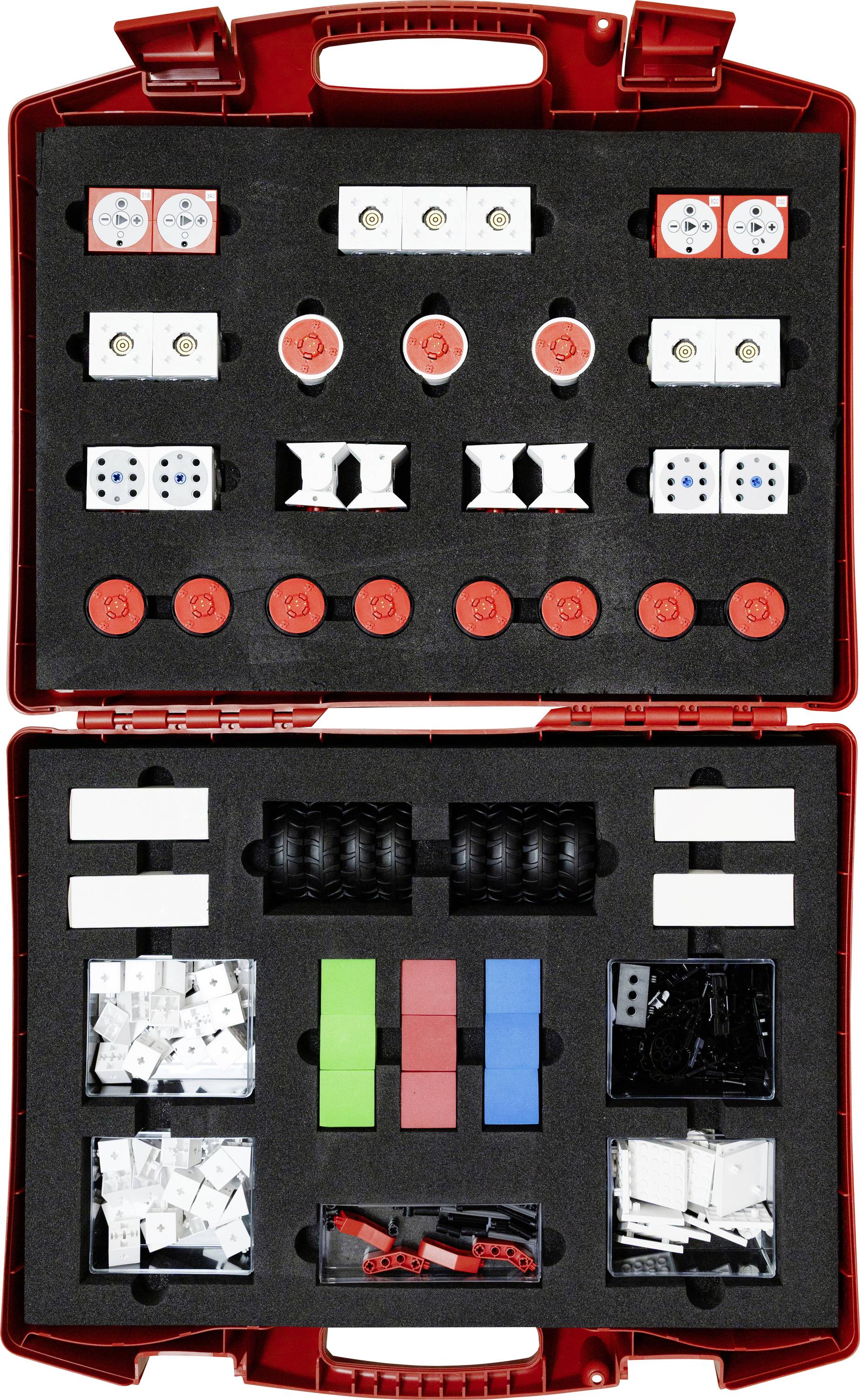 Boîtier rouge ouvert contenant des composants Lego Robotics organisés, incluant des roues, des capteurs, des briques et des connecteurs, utilisés pour la construction de robots.