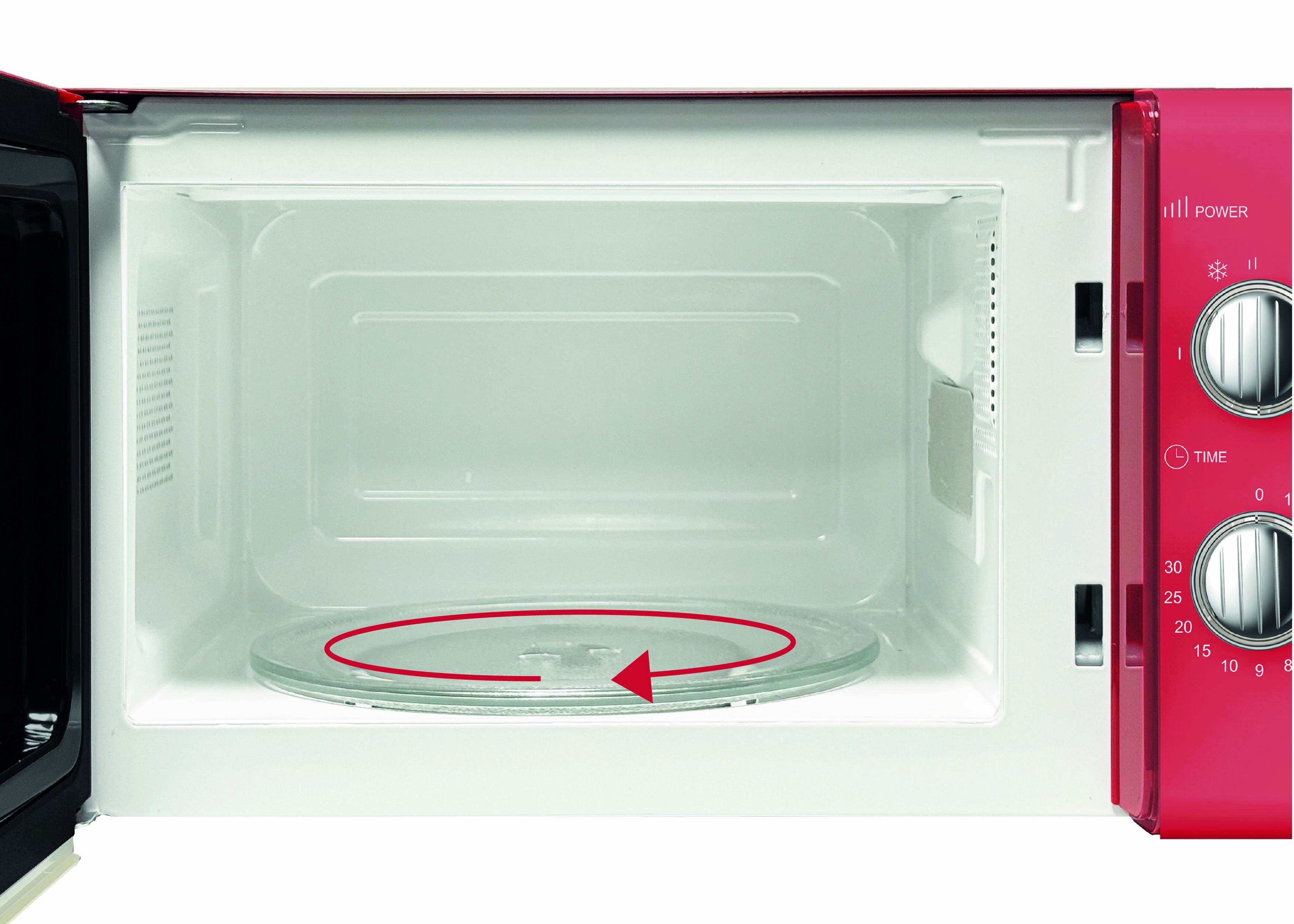 Ouvrez le micro-ondes avec un plateau tournant en verre et une flèche rouge indiquant le sens de rotation. Des boutons de commande pour la puissance et le temps sont visibles sur le côté.