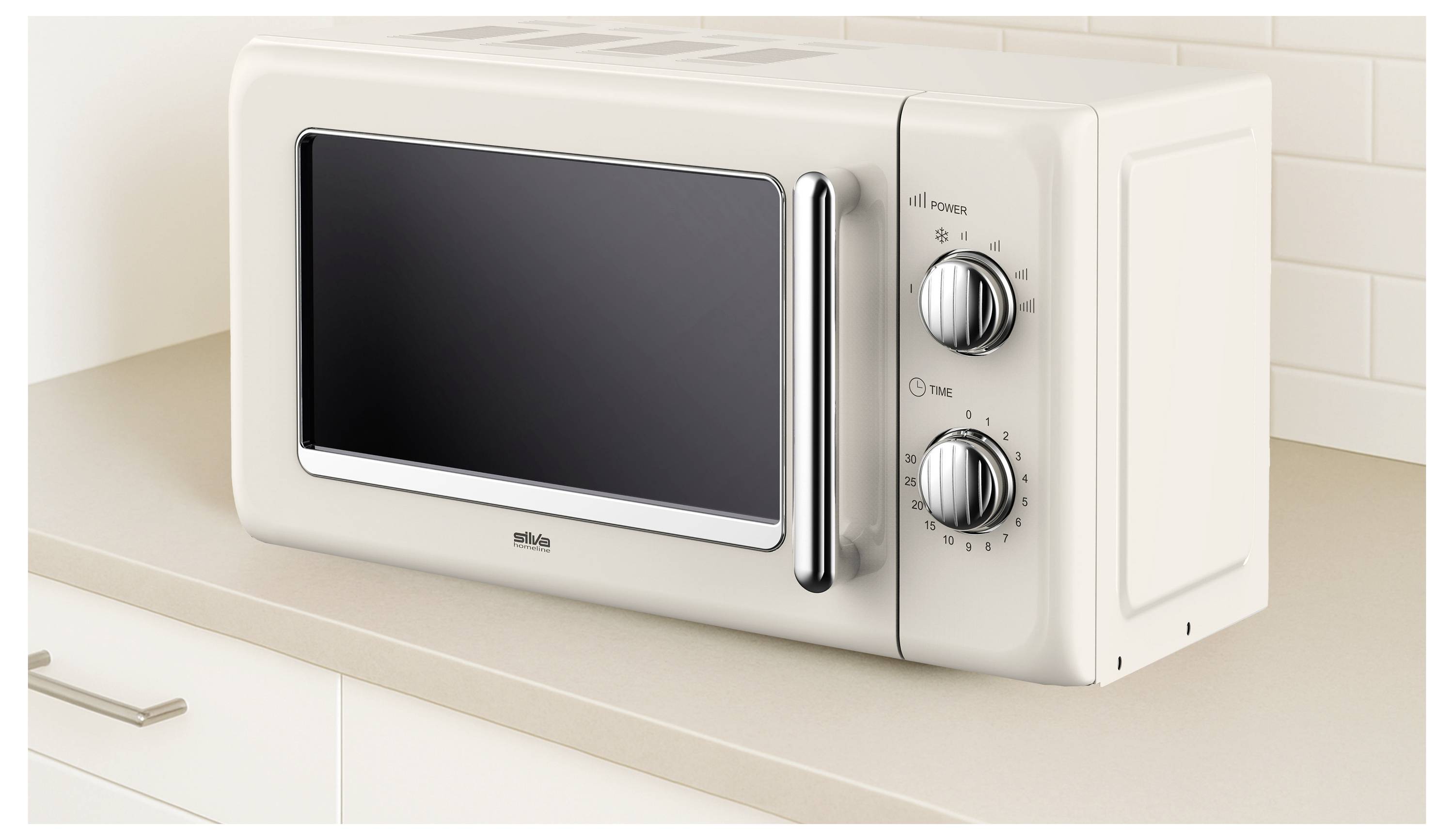 Un four à micro-ondes beige avec deux boutons de réglage est posé sur un comptoir de cuisine de couleur claire, devant un carrelage mural.