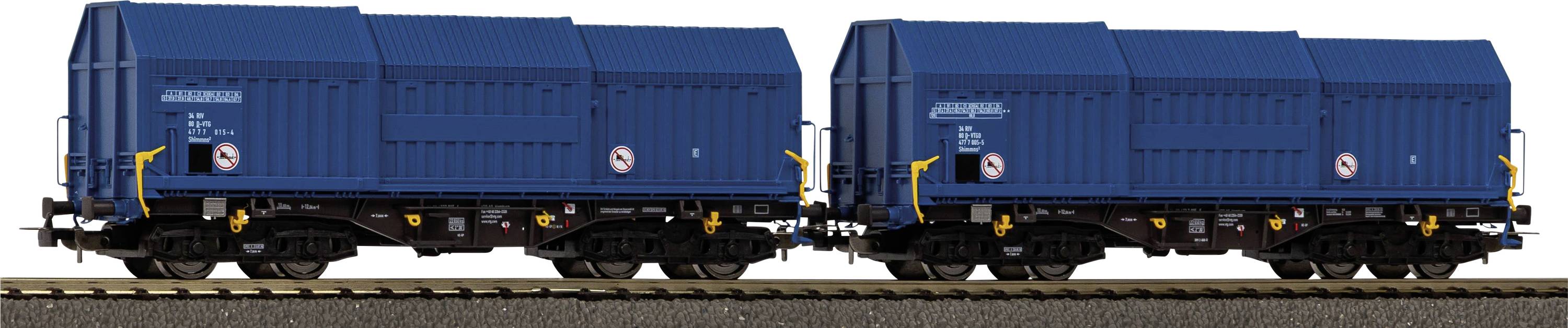 Deux wagons de fret ferroviaires bleus sur des rails, présentant un symbole d'interdiction de fumer sur le côté. Les wagons sont conçus pour le transport de marchandises.