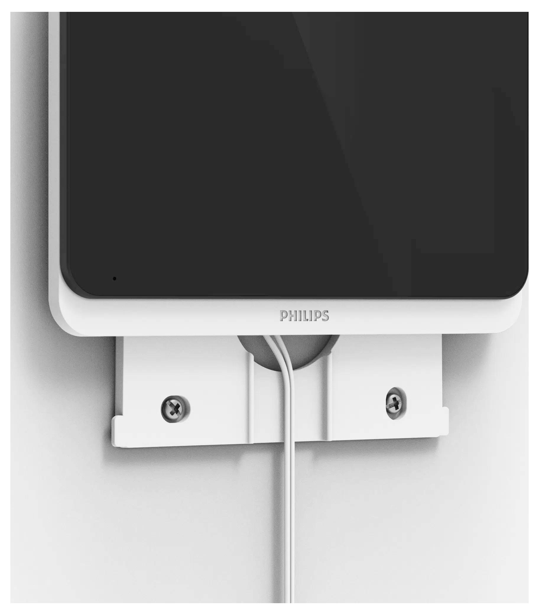 Support mural blanc en forme de support avec des vis maintenant un appareil étiqueté « PHILIPS » ; un cordon s'étend depuis la partie inférieure.