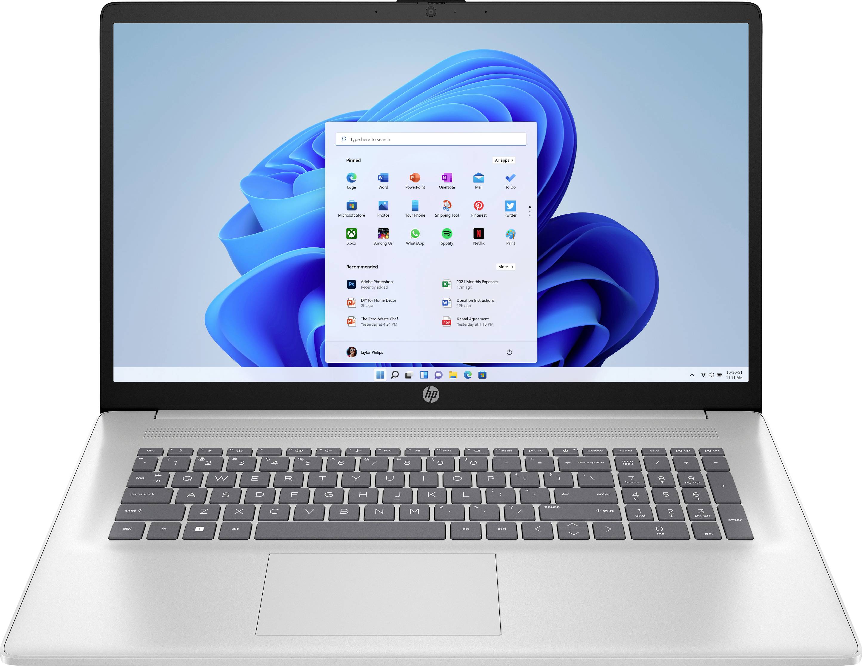 Ein Laptop, der den Windows-11-Startbildschirm mit verschiedenen sichtbaren App-Symbolen anzeigt.