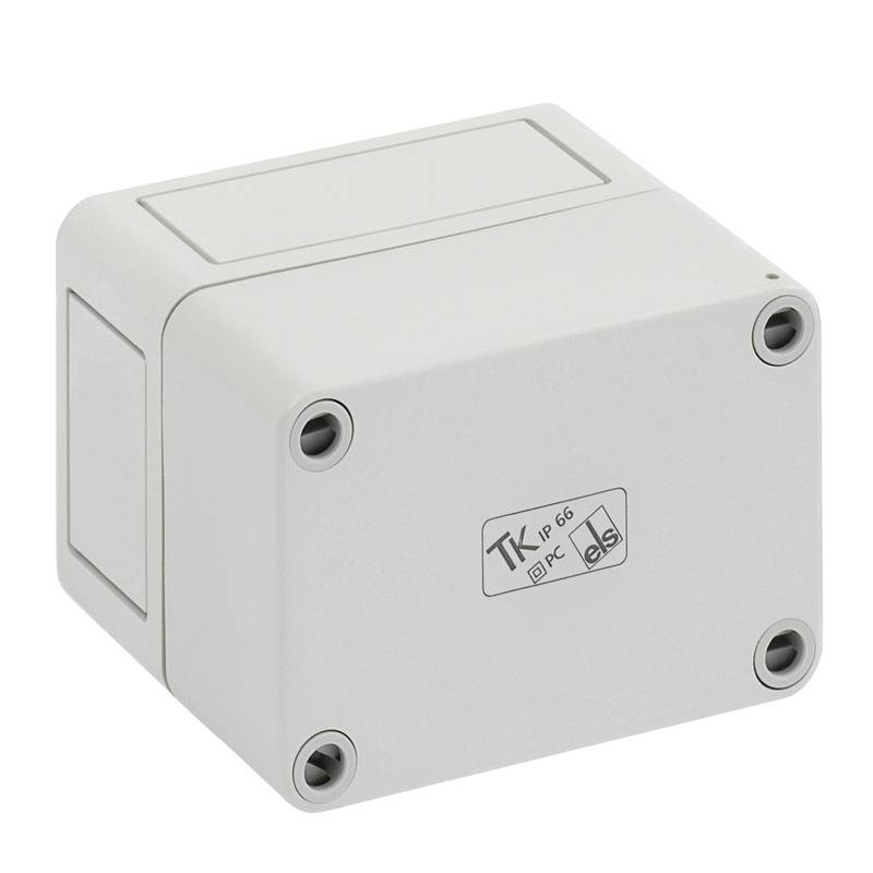 Boîtier de jonction électrique gris clair avec quatre trous de vis aux angles et un couvercle scellé, présenté sur un fond blanc.