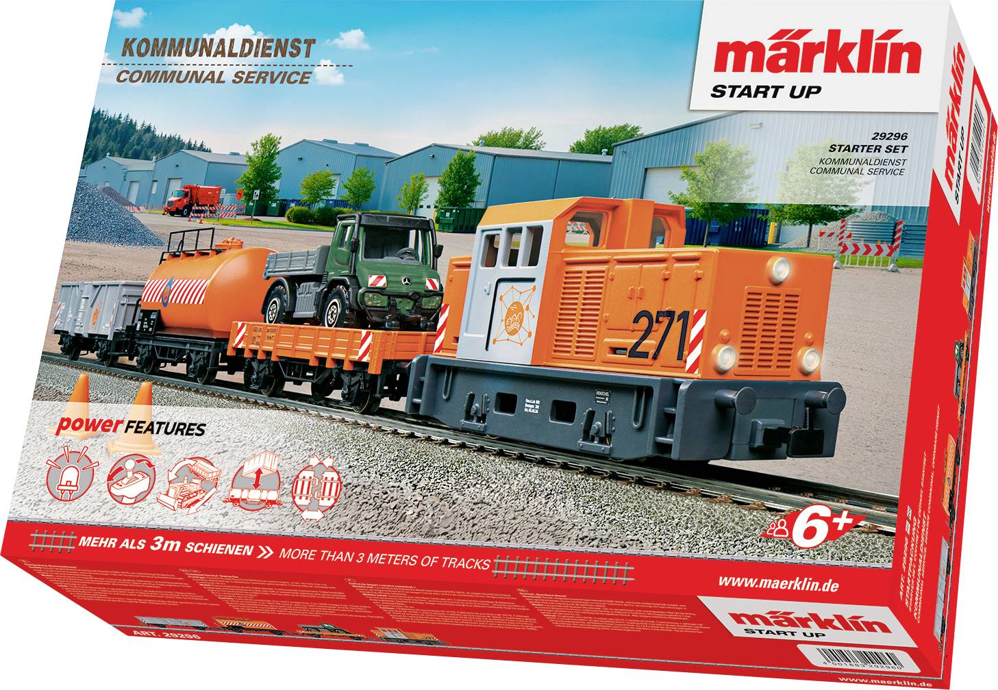 Boîte de set de démarrage pour train miniature montrant un train orange vif et gris avec des wagons de marchandises sur des rails, situé dans un paysage pittoresque.