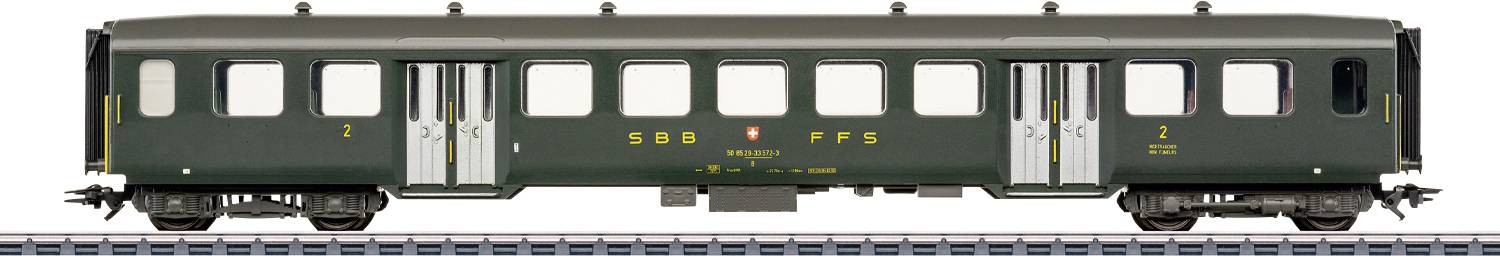 Une voiture de passagers ferroviaire verte vintage avec l'étiquette « SBB CFF FFS » sur le côté, affichant un design classique du milieu du XXe siècle.