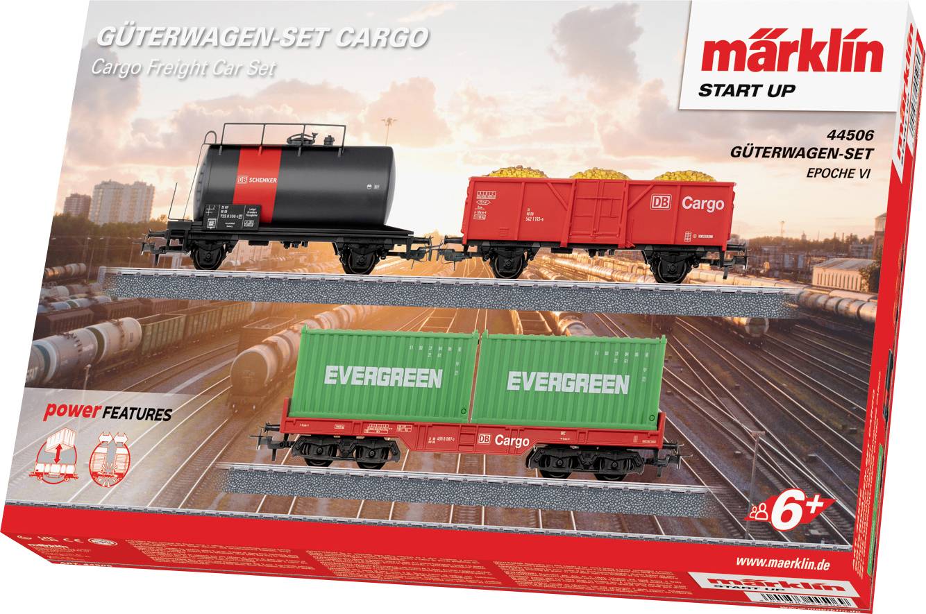Boîte de set de train miniature représentant deux wagons de marchandises, l'un transportant des conteneurs de fret marqués « Evergreen » et un autre wagon pour matériaux en vrac. Marqué pour les âges 6 ans et plus.
