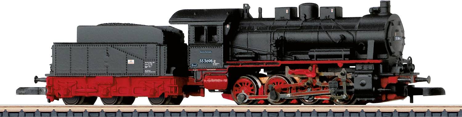 Une locomotive à vapeur modèle noir et rouge exposée sur une voie, montrant les roues détaillées et les composants du moteur.