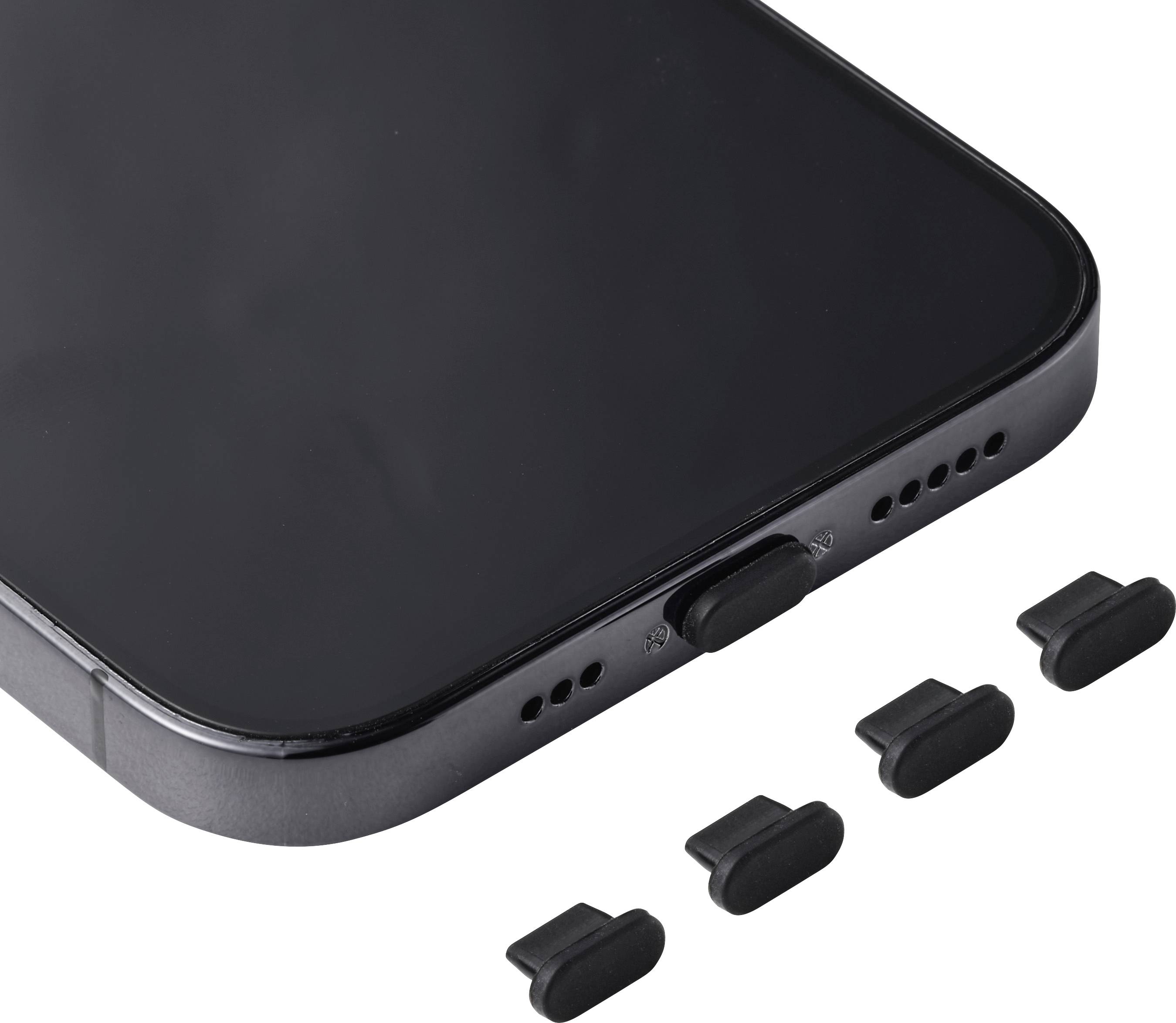 Gros plan du bord inférieur d'un smartphone montrant un port de charge et des trous de haut-parleur, avec quatre petits capuchons noirs à côté.