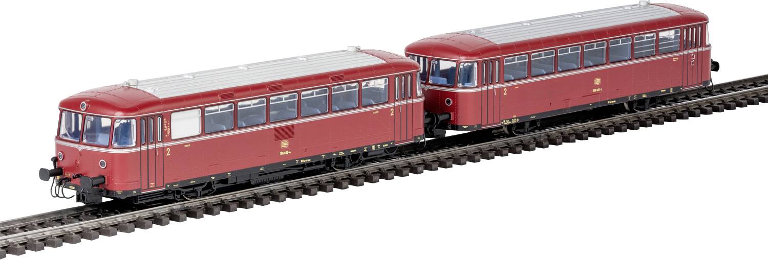 Deux voitures de train vintage rouges sur des rails, mettant en évidence les conceptions détaillées des fenêtres et du toit, positionnées bout à bout.