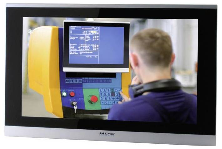 A person operates a yellow industrial machine with a digital display and various control buttons, focused on a blue screen showing data.