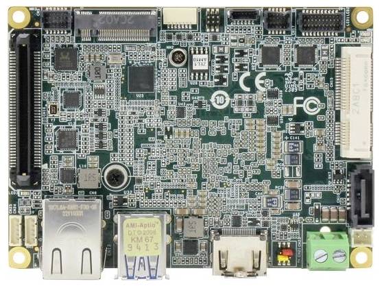A green circuit board with various electronic components, connectors, and ports, including USB and Ethernet, for a computing device.