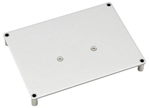 A rectangular silver metal plate with rounded corners, two central screws, and four screw holes near the edges. It is supported by small legs.