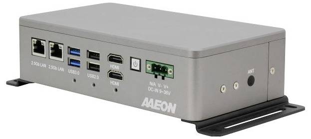 A rectangular, metallic computer hardware box with various ports, including LAN, USB, HDMI, and power connectors on the front panel.