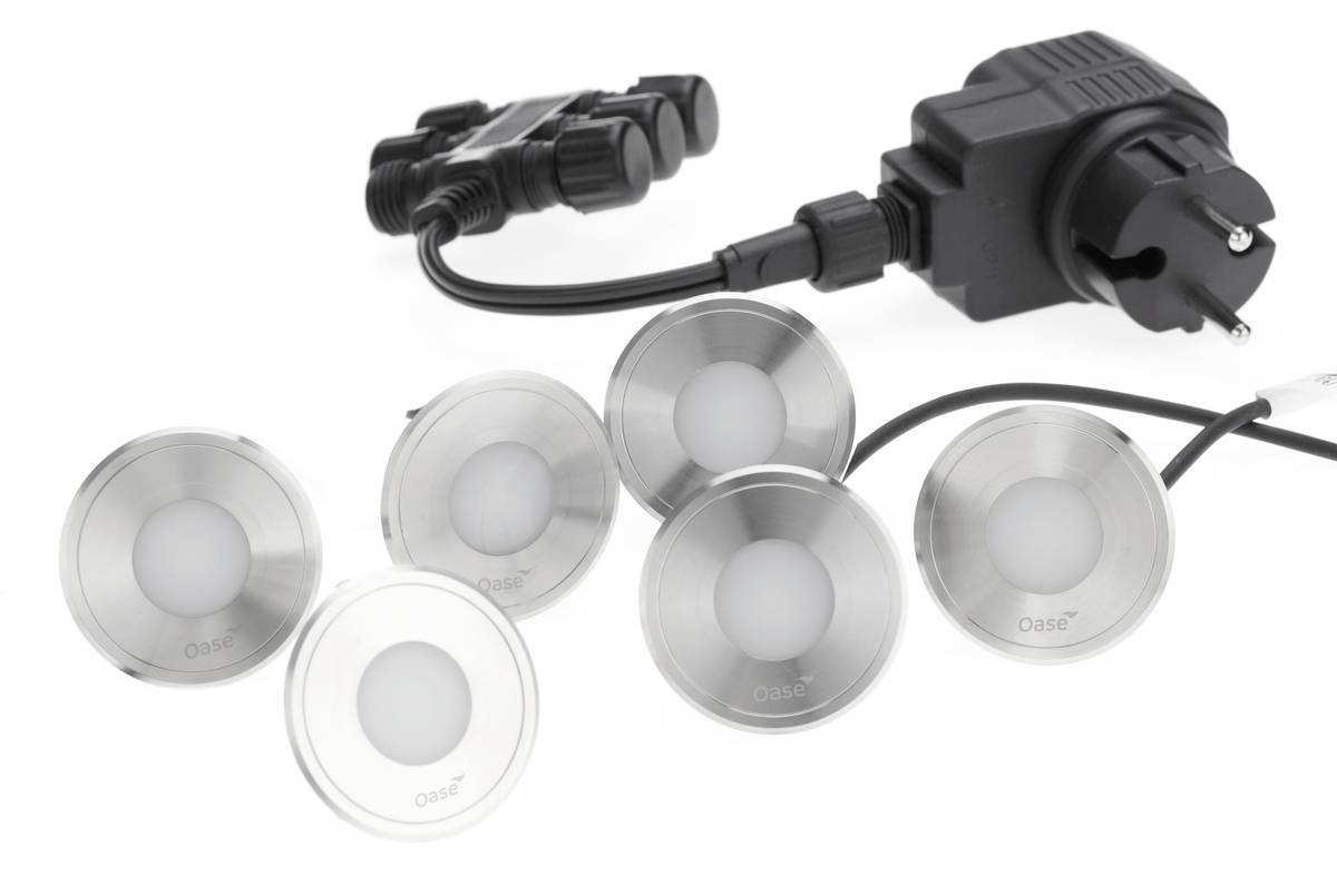 Set of five round LED pond lights with a power adapter and connectors on a white background.