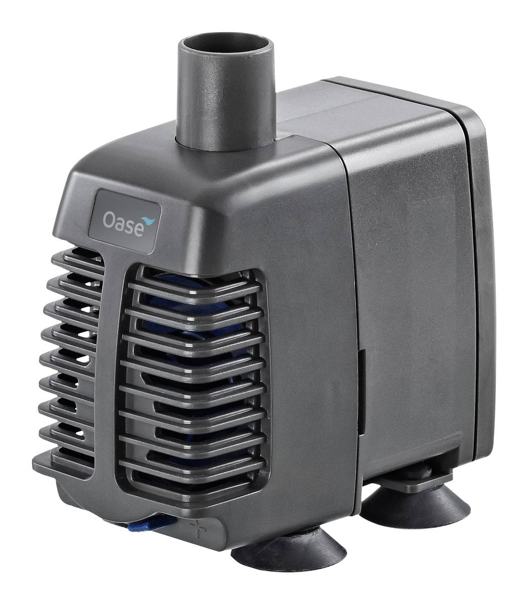 Black Oase water pump with top outlet, front intake grille, and suction feet, shown on a white background.