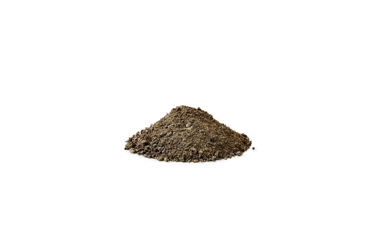 Small mound of brown soil or dirt isolated on a white background.