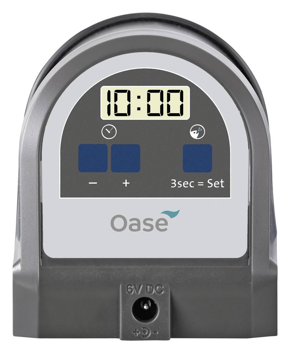 Digital timer device showing 10:00, with blue buttons for minus, plus, and '3sec = Set', branded Oase.