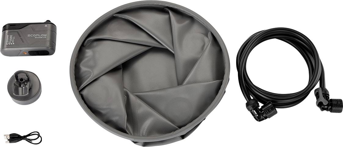 Une trousse d'outils de camping gonflable avec un compresseur, un matelas pneumatique plié, un adaptateur secteur, un câble USB et un tuyau à air.