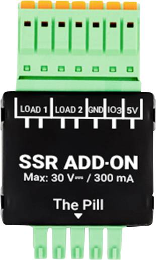 « Complément SSR Max : 30 V / 300 mA La Pilule » est affiché sur un petit composant électrique avec des connecteurs étiquetés « LOAD 1 », « LOAD 2 », « GND » et « 5V ».