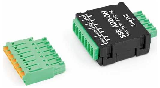 'MODULE ADDON SSR, Max 30V – 300 mA, La Pilule' texte sur un module électronique noir, broches de connecteur vertes, présenté aux côtés d'un connecteur détachable vert.