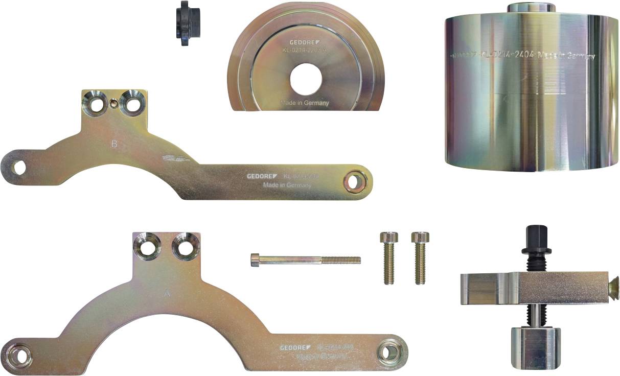 Outils automobiles métalliques assortis disposés, y compris des supports, un grand cylindre, un tendeur et des vis, utilisés pour les réparations de véhicules.