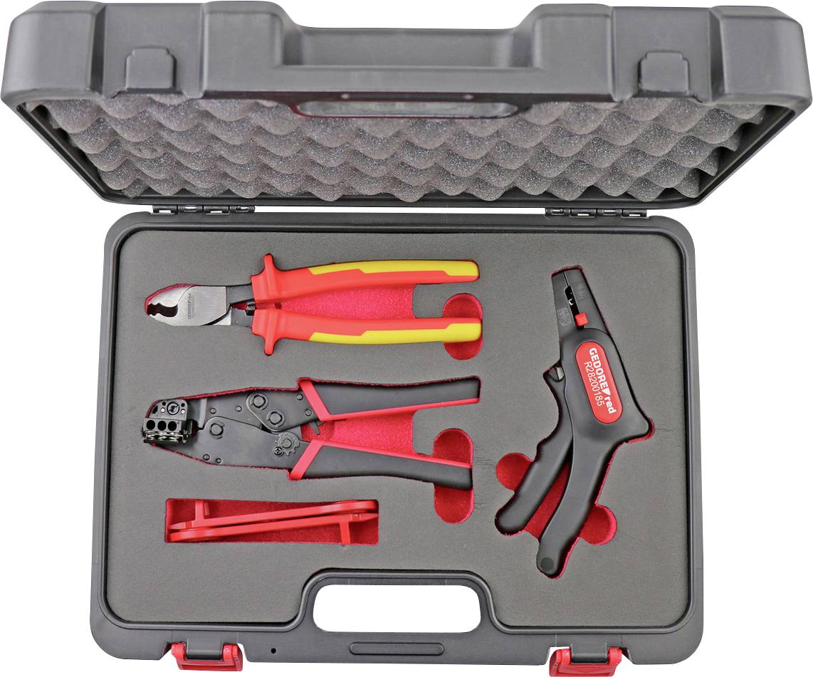 Un étui à outils en plastique contenant trois outils manuels rouges et noirs — un couteau, un outil de sertissage et une dénudeuse — dans des emplacements ajustés.