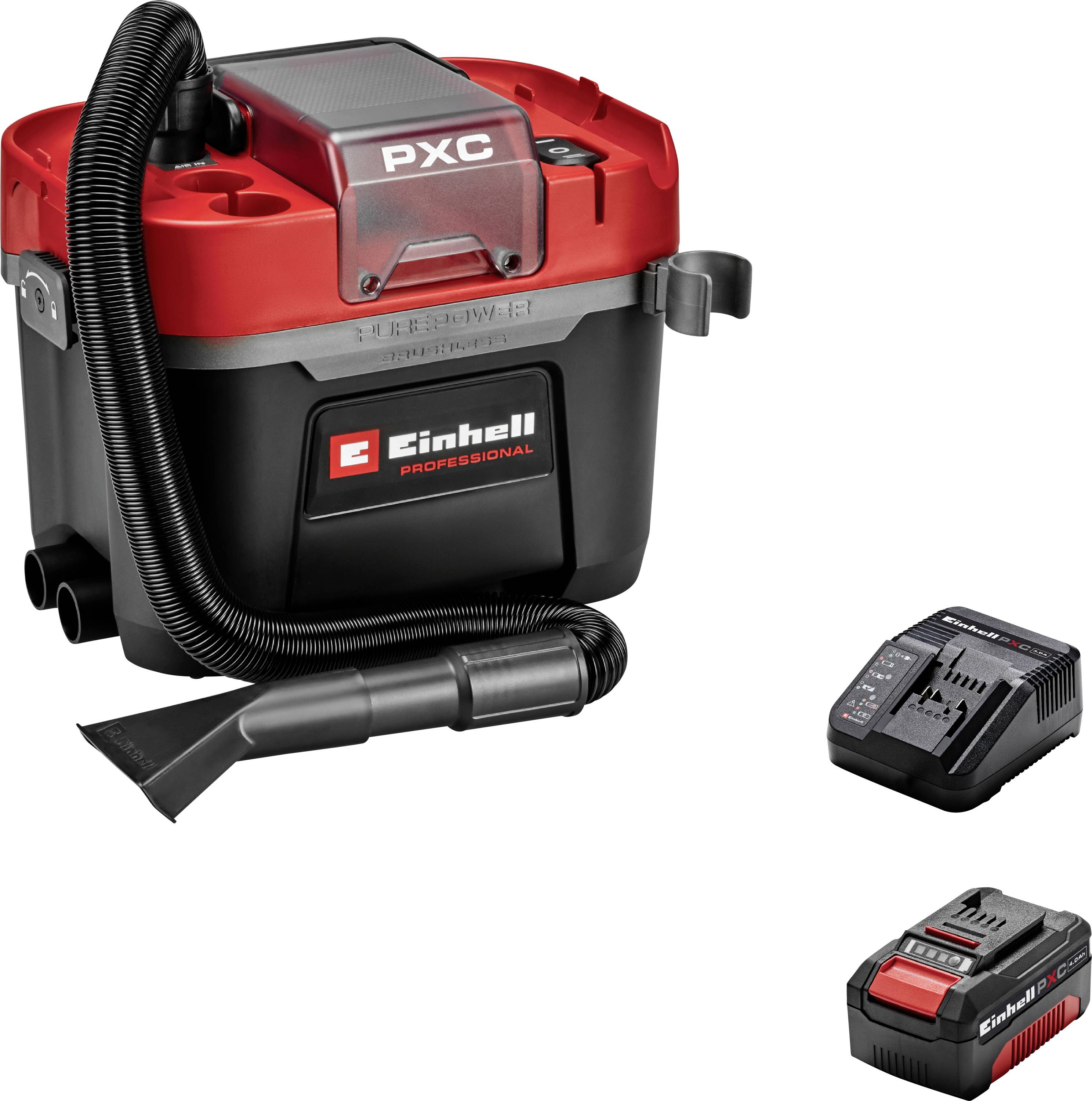 Un aspirateur portatif rouge et noir avec un tuyau et une buse interchangeable. Comprend une batterie et un chargeur sur le côté.