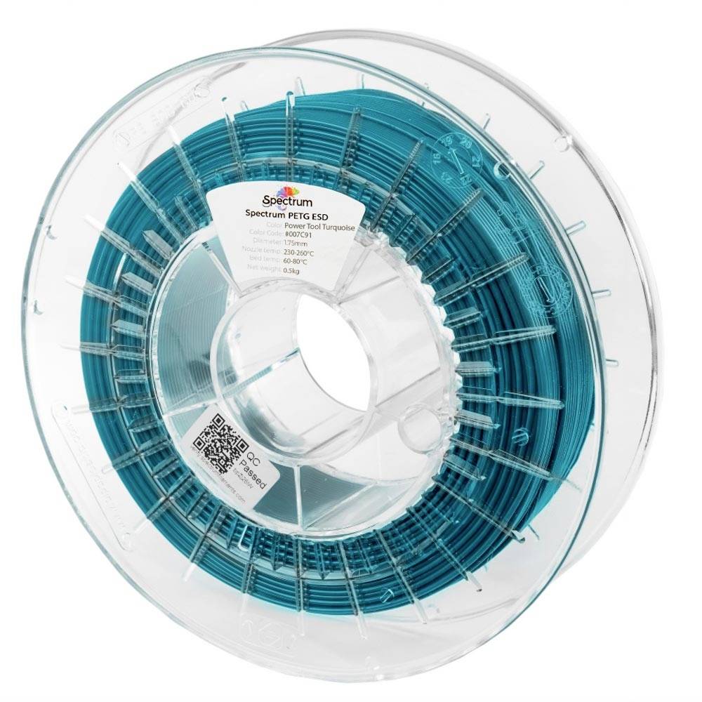 Bobine de filament PETG turquoise transparent pour imprimante 3D sur une bobine en plastique transparent, étiquetée Spectrum PETG ESD.