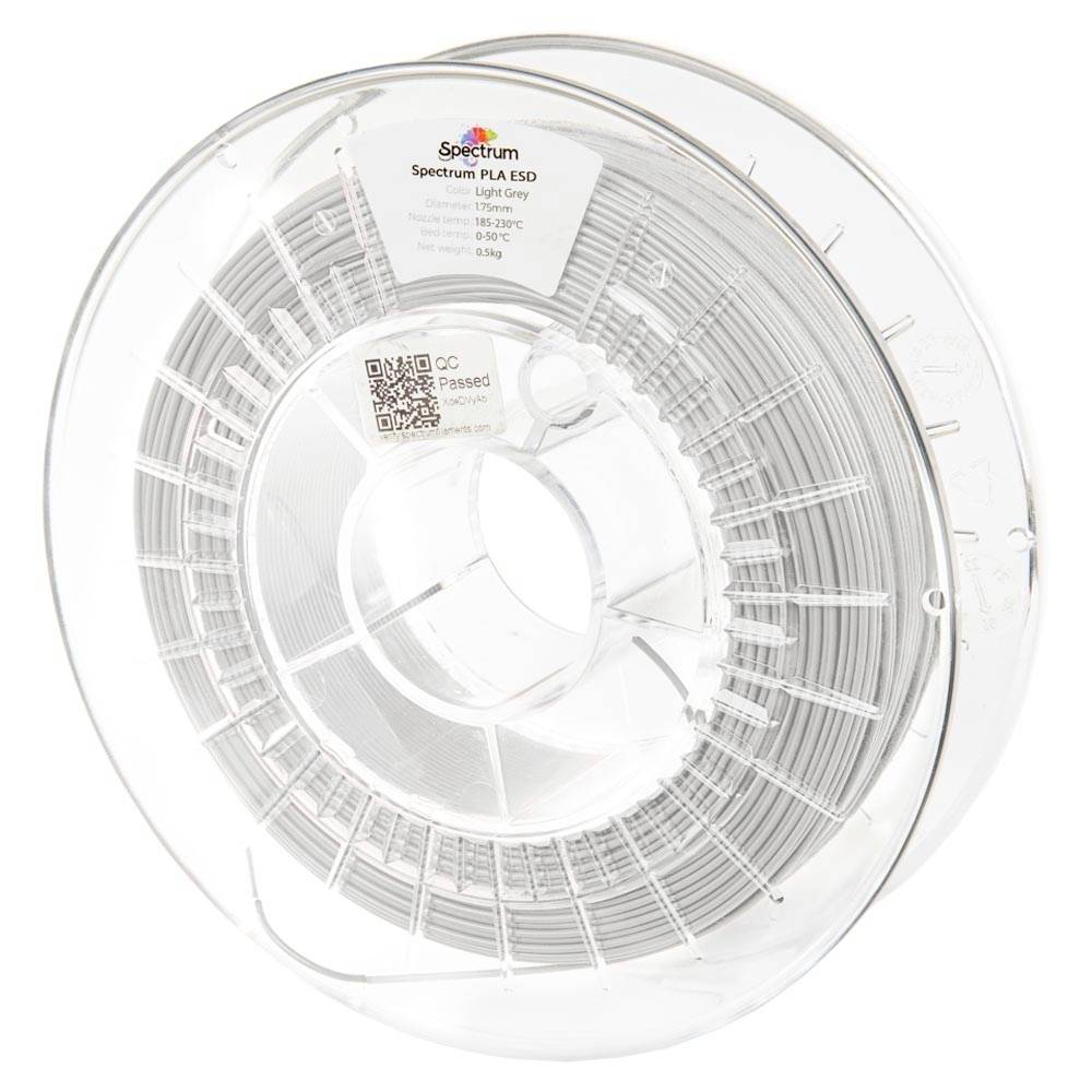 Bobine transparente de filament d'imprimante 3D blanc pur étiquetée « Spectrum PLA ESD » sur une bobine transparente