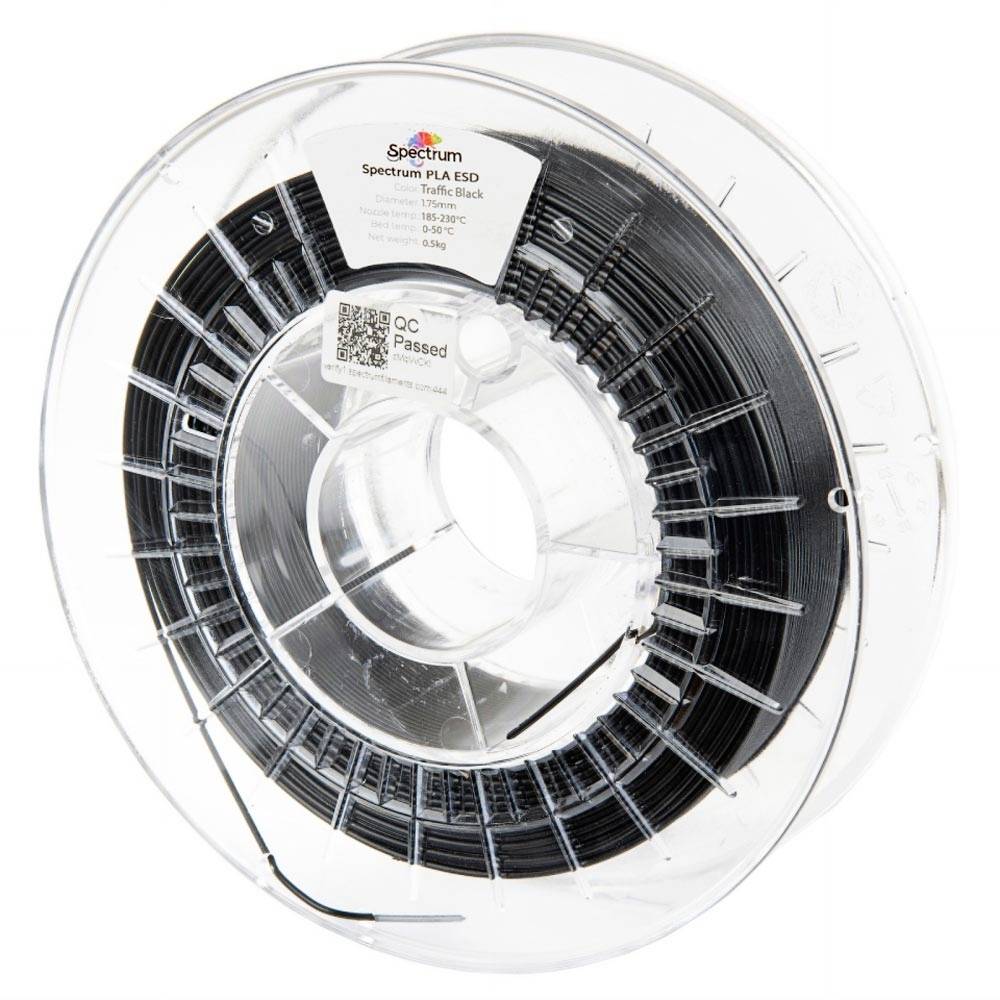 Bobine de filament PLA Spectrum noir pour imprimante 3D dans une bobine en plastique transparent sur un fond blanc.