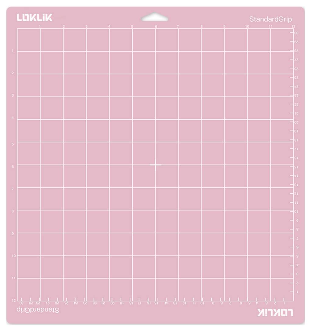 'Un tapis de découpe rose avec une grille et des mesures le long des bords, étiqueté 'LOKLIK StandardGrip'. Idéal pour les tâches de découpe précises.'