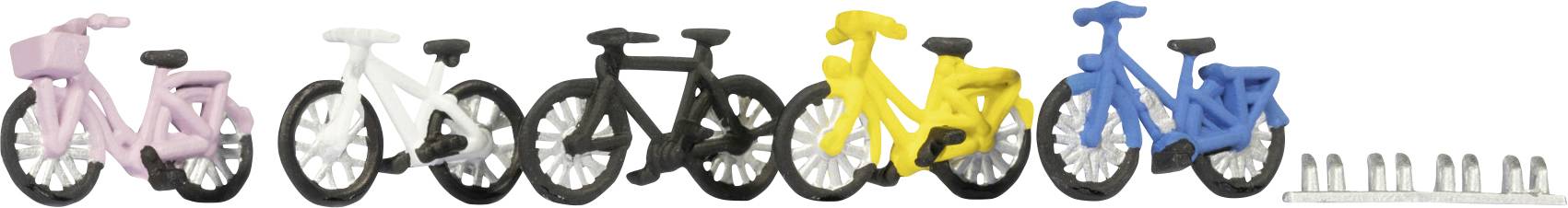 Des modèles de bicyclettes en plastique coloré alignés en rangée : rose, blanc, noir, jaune et bleu, suivi de petits cylindres métalliques à droite.