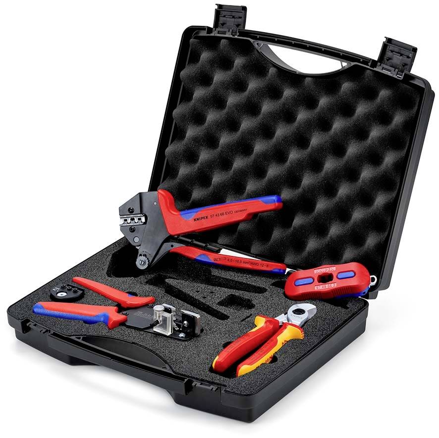 Étui de transport noir ouvert avec des inserts en mousse maintenant des outils de sertissage et de dénudage de fils de couleur rouge et bleu.