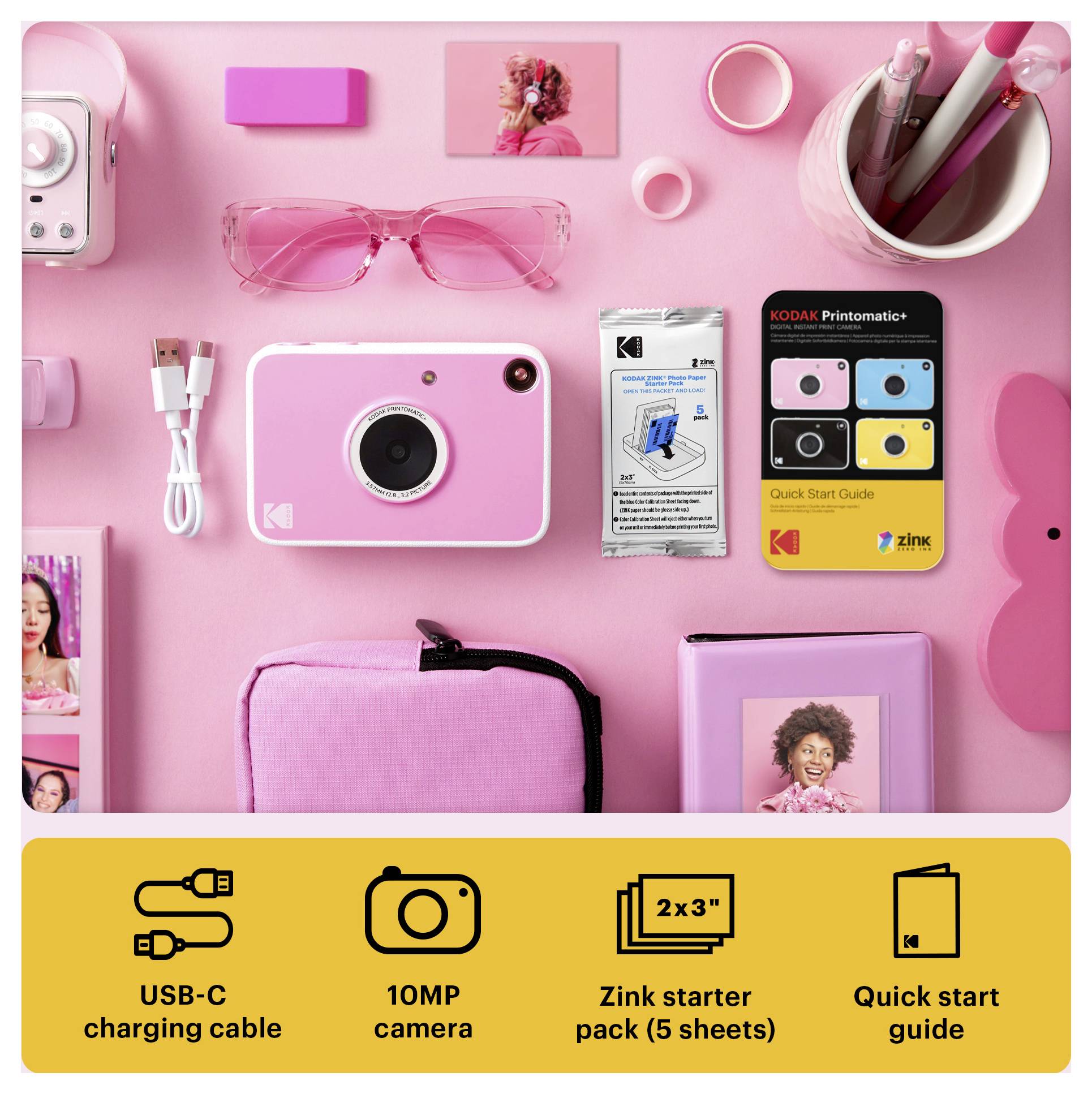 Mise à plat rose d'un kit appareil photo instantané Kodak Printomatic comprenant l'appareil photo, un câble USB-C, un appareil photo 10MP, un paquet de papier Zink, et un guide de démarrage rapide.