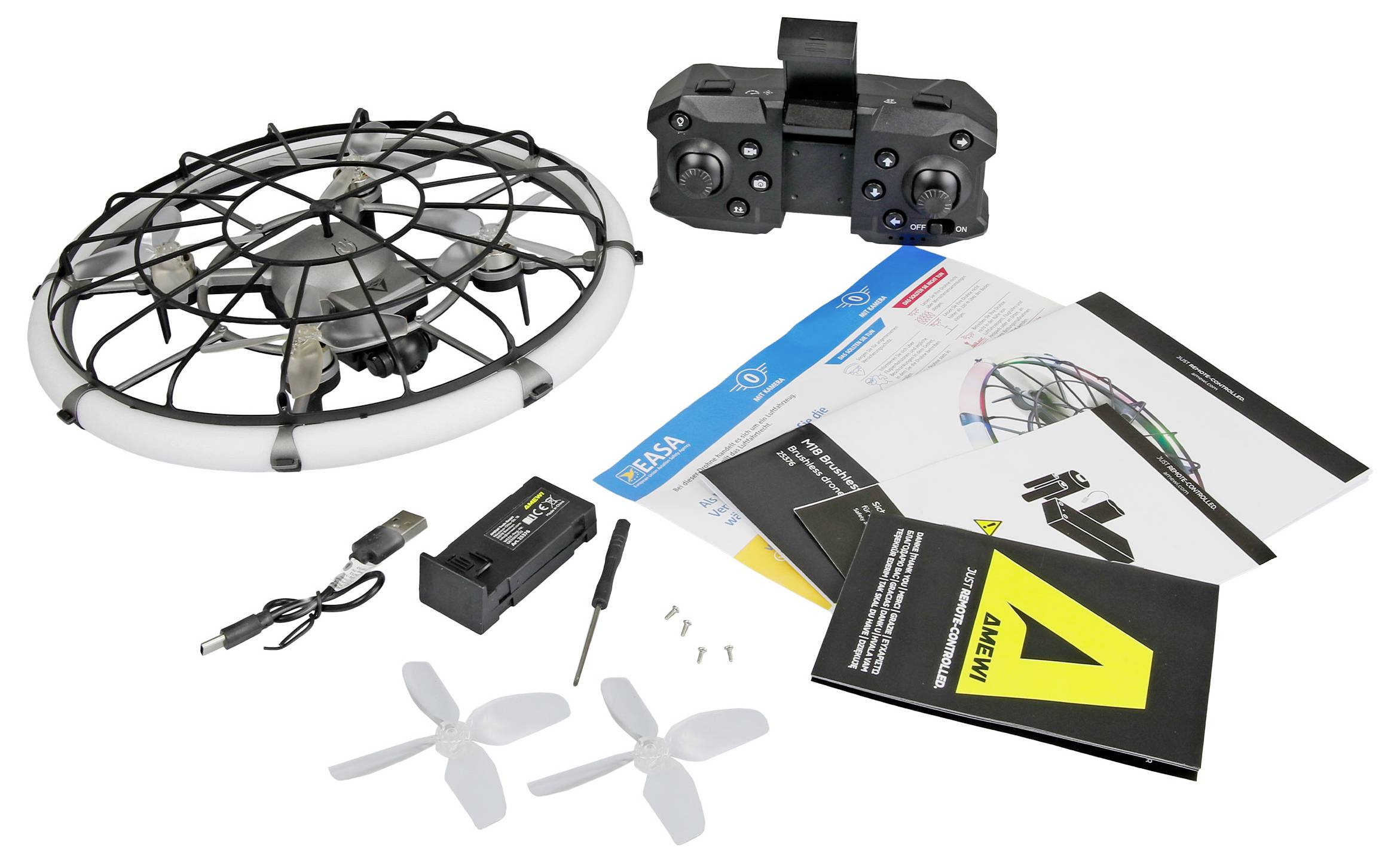 Kit de drone avec cage de vol fermée, contrôleur, batterie, chargeur, hélices de rechange, outil et manuels d'instruction sur fond blanc.