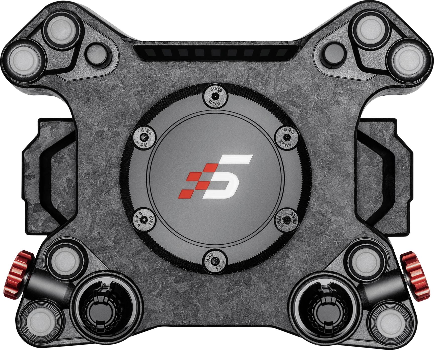 Vue de dessus d'un appareil mécanique gris avec un moyeu circulaire central marqué d'un logo « S », entouré de quatre supports d'angle et de boutons latéraux rouges.