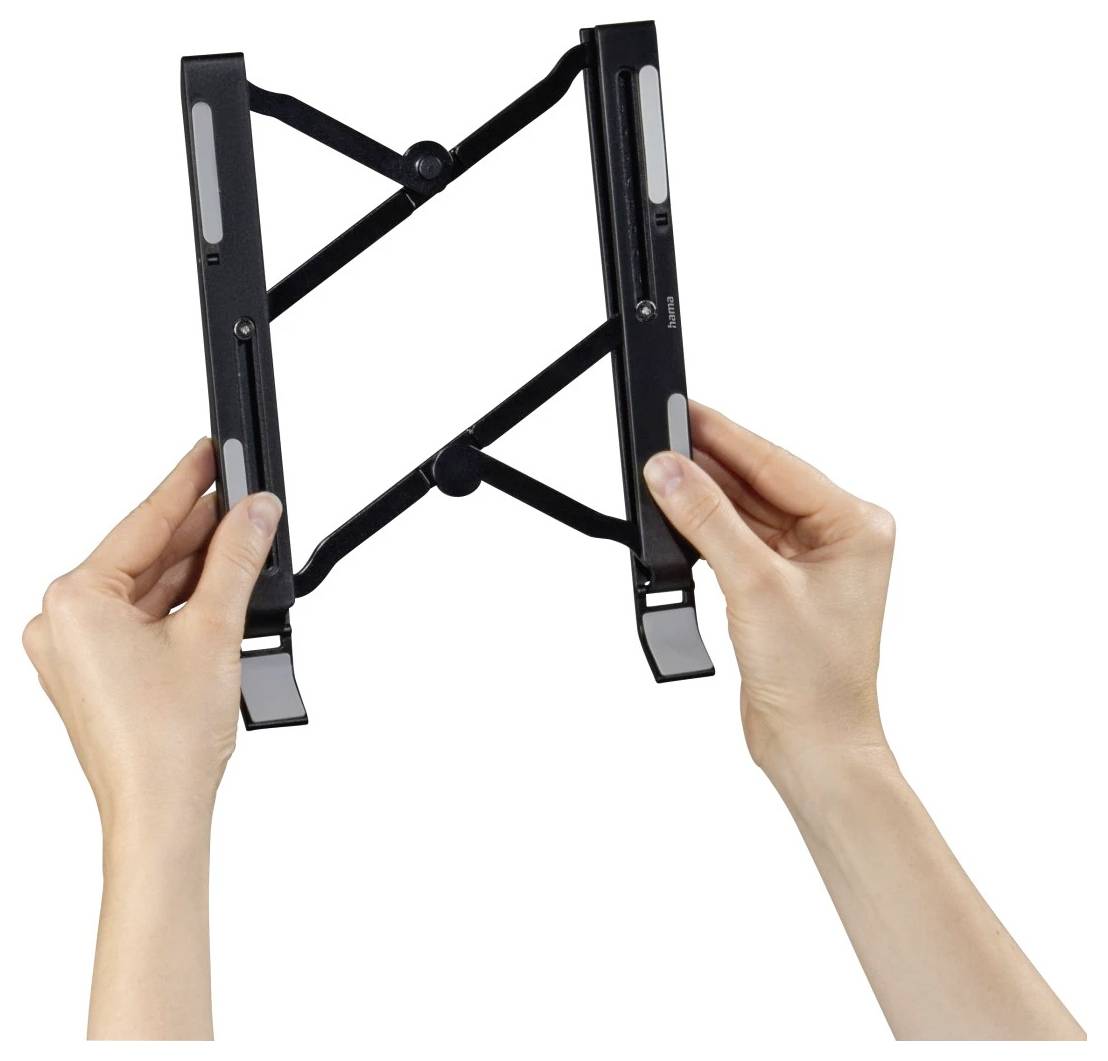 Hands hold an adjustable black scissor-style wall mount bracket with foldable arms on a white background.