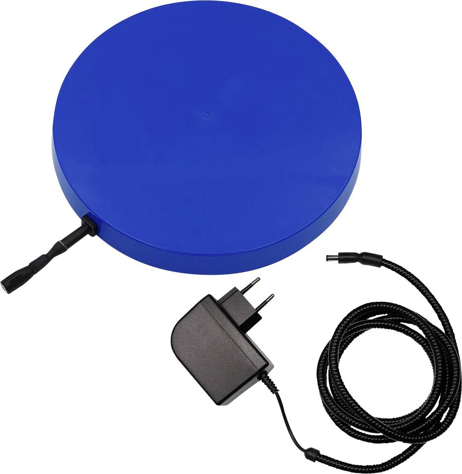 Dispositif électronique circulaire bleu avec un adaptateur secteur et un câble enroulé sur un fond blanc.