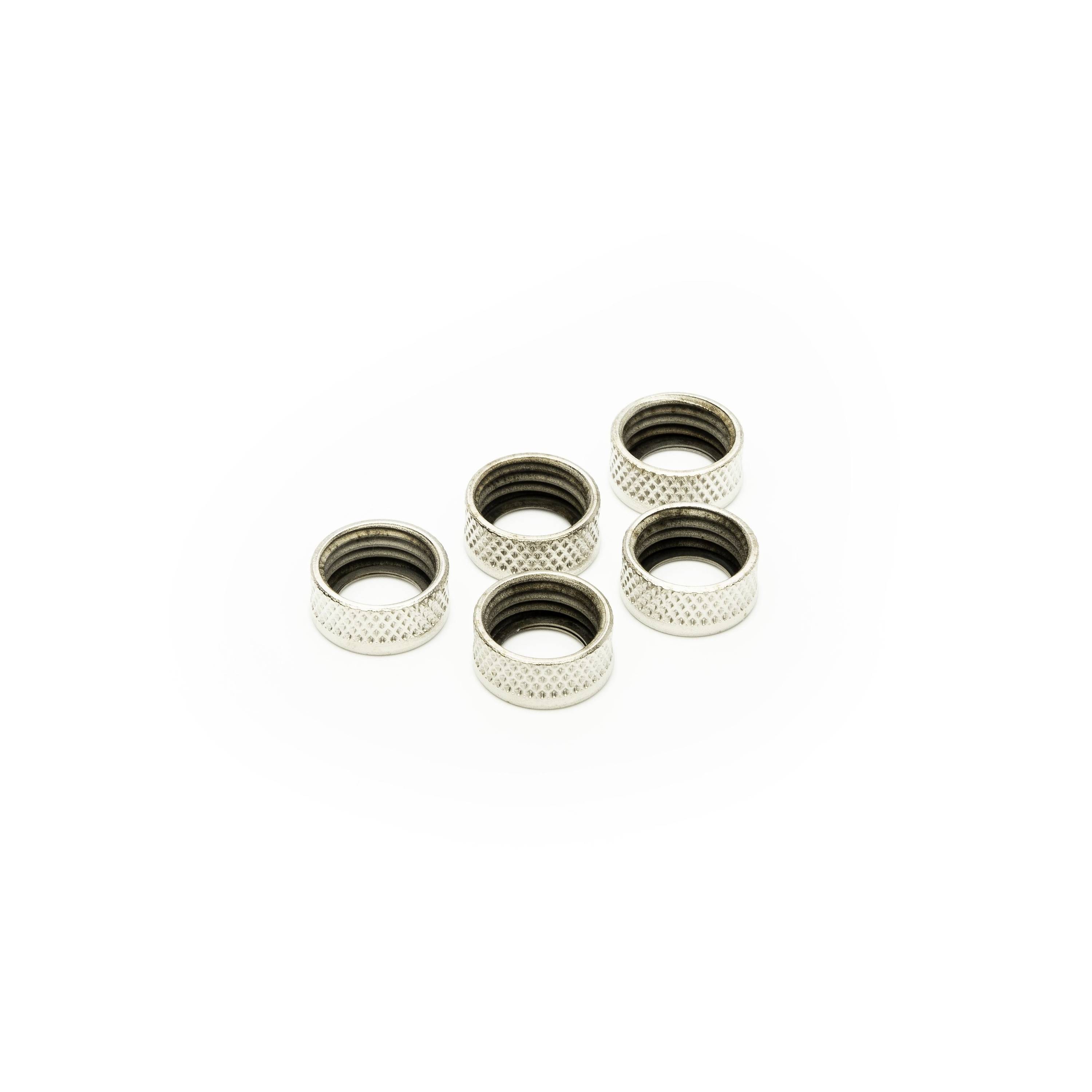 Five small silver metal ring components arranged on a white background.