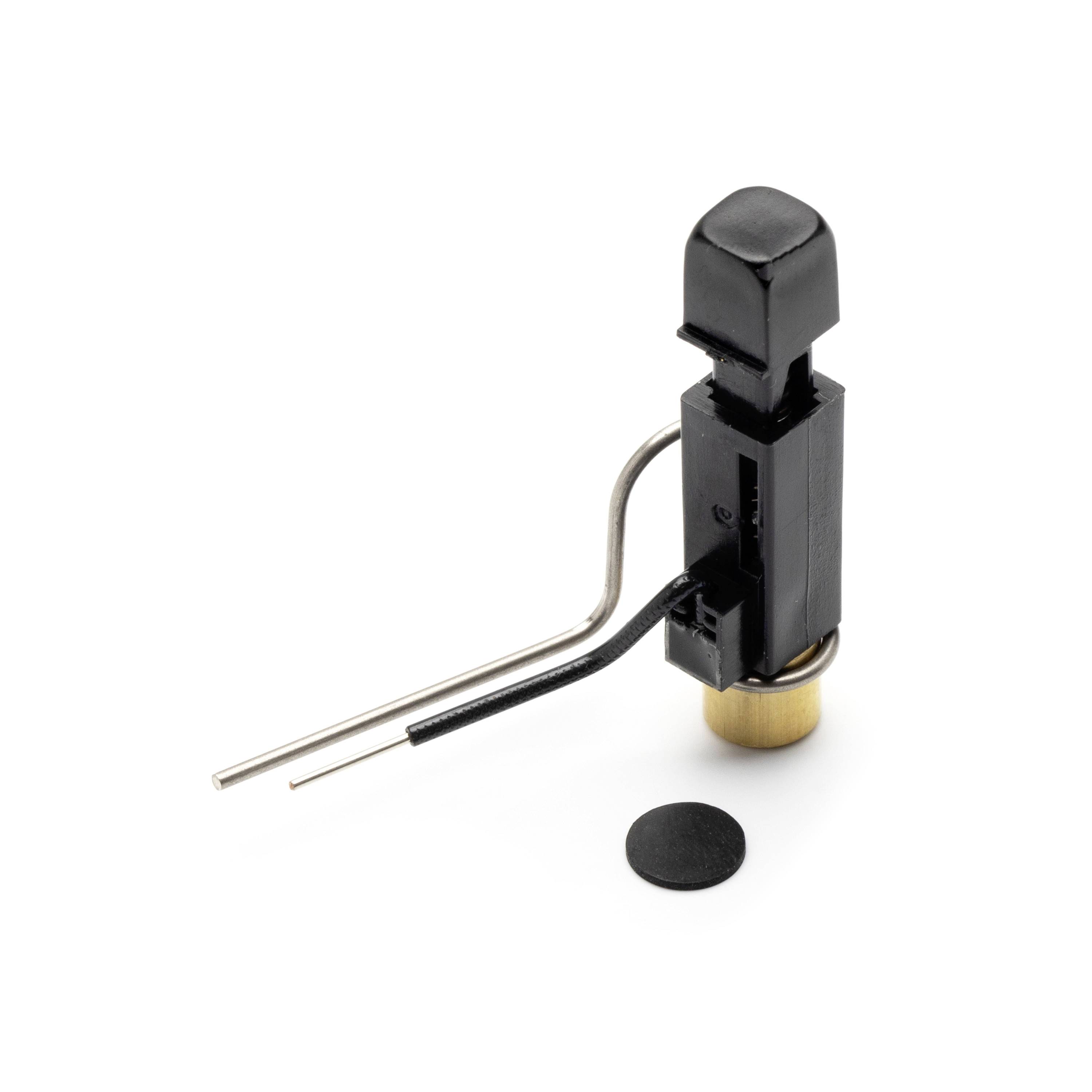 Small black electronic switch component with two metal leads and a separate round black cap on a white background.
