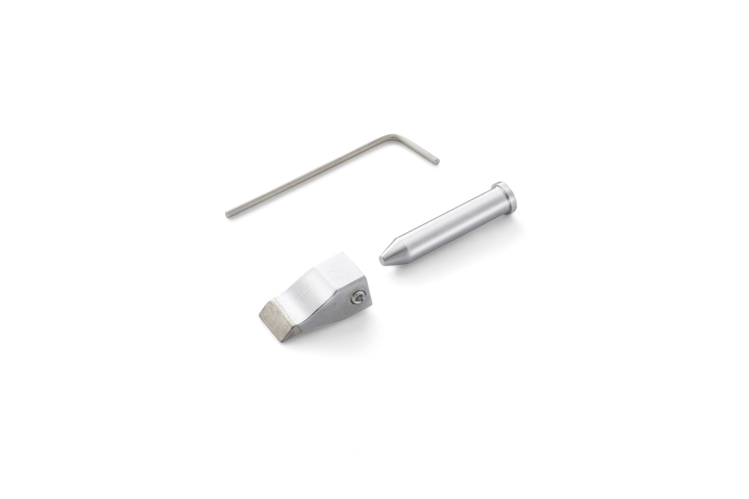Three metal parts on a white background: an L-shaped hex key, a tapered pin, and a small angled metal block.