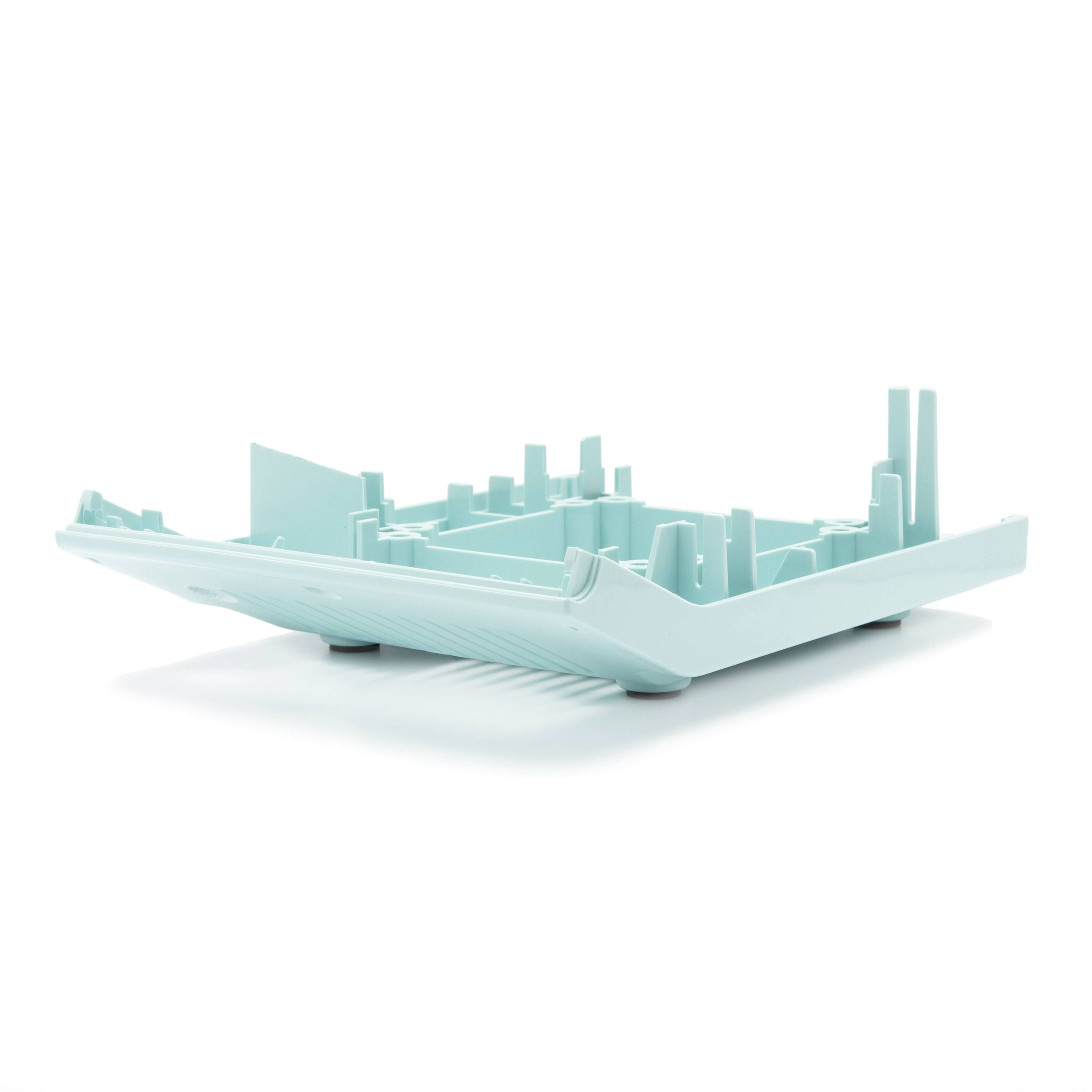 3D turquoise city skyline model inside an open book, symbolizing urban planning or architecture concept